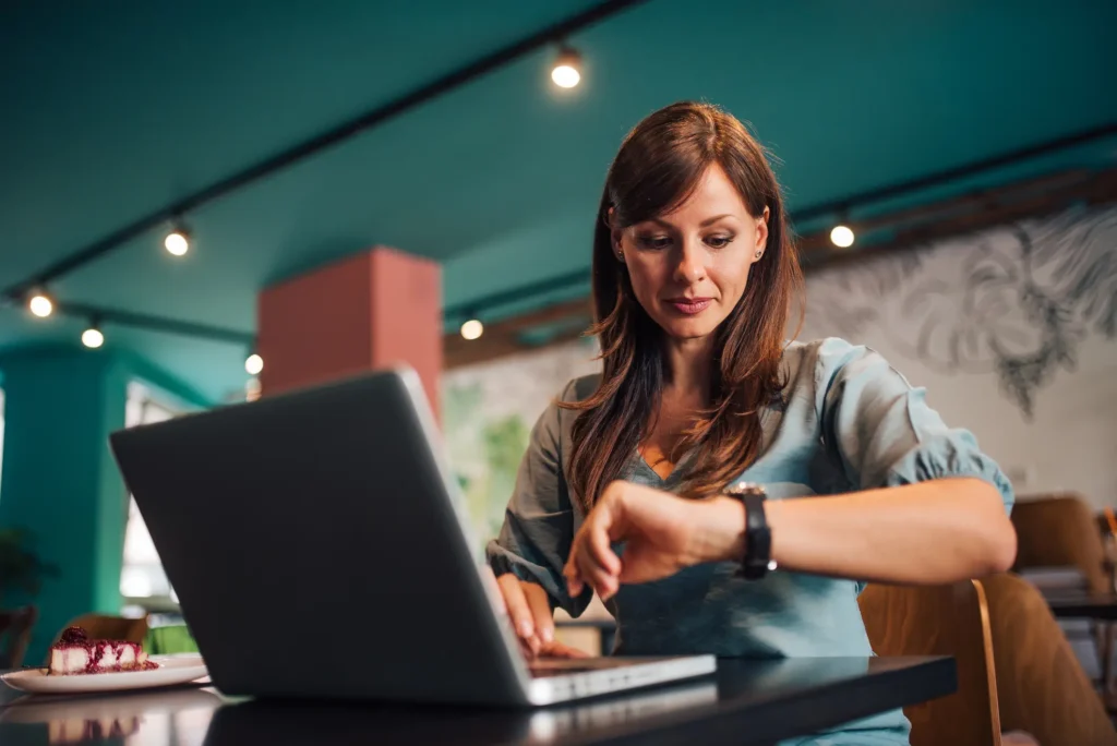 A woman using a digital planner to stay organized at work with ADHD Beawareofmecom A woman using a digital planner to stay organized at work with ADHD