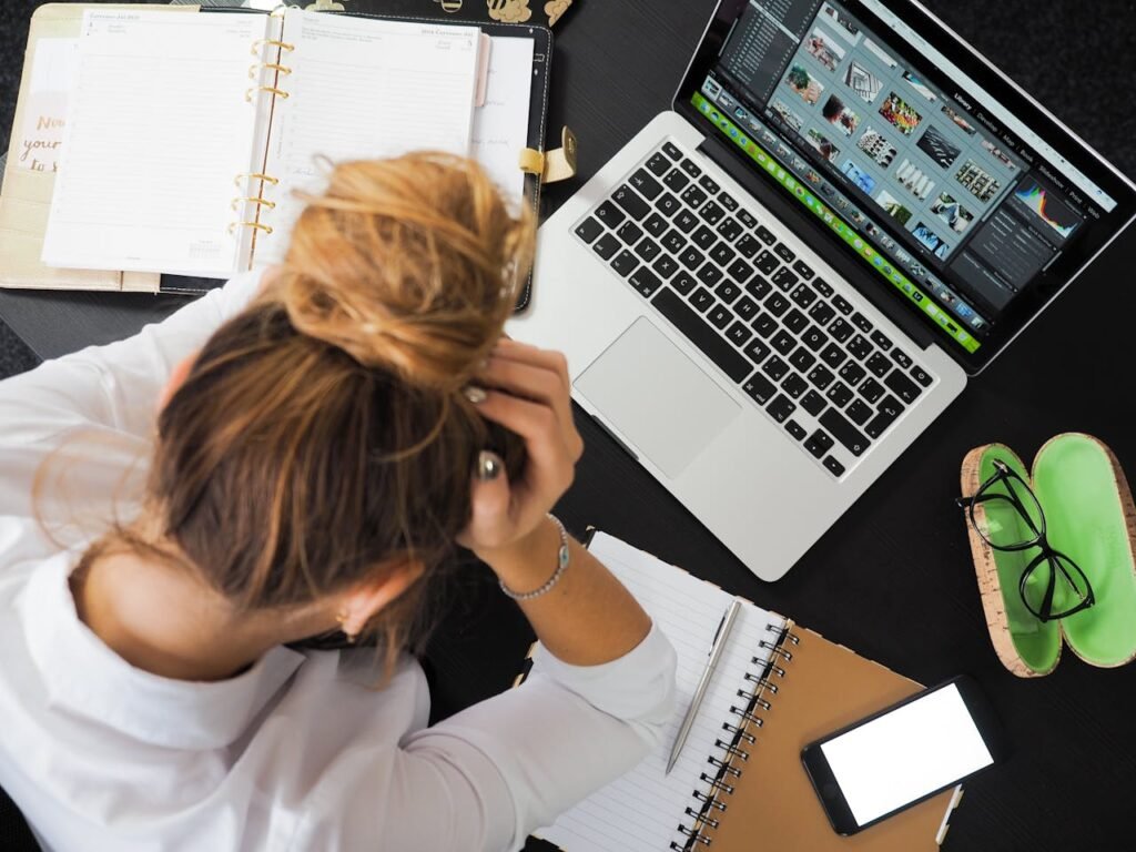 Tips for Managing Stress at Work 3 Beawareofmecom An individual practicing mindfulness and deep breathing exercises at their desk illustrating stress management techniques