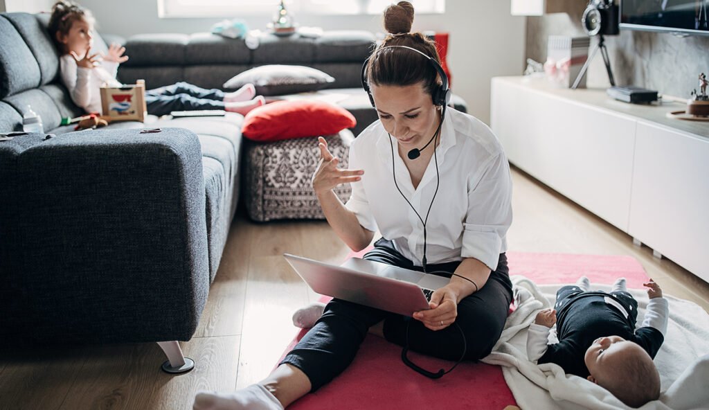 Busy single mother working at home and babysitting Beawareofmecom Balancing Work and Life When You're Always On Call
