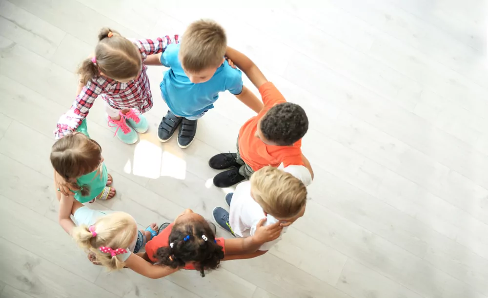 Social Development kids Beawareofmecom Children standing in a circle with arms around each other showing how gentle parenting actually affects kids by encouraging social bonding and emotional security