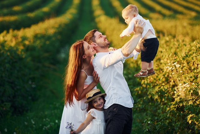 Father mother with daughter and son spending free time outdoors at sunny day time of summer Beawareofmecom Indiana Parenting Time Guidelines Explained Clearly