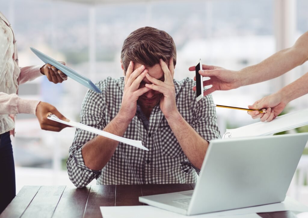 Stressed man frustrated with electronic devices Beawareofmecom Stress for Busy Professionals