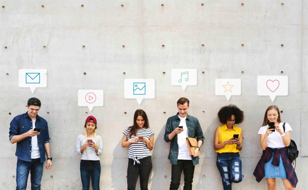 Group of diverse people using their phones Beawareofmecom teen social media addiction symptoms